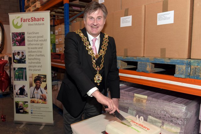 Lord Mayor Carl Rice cuts the FareShare West Midlands cake. FareShare West Midlands are celebrating 10 years of fighting hunger and food waste.