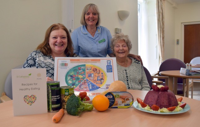 Staff at St Catherine's Hospice with surplus food delivered to them by FareShare